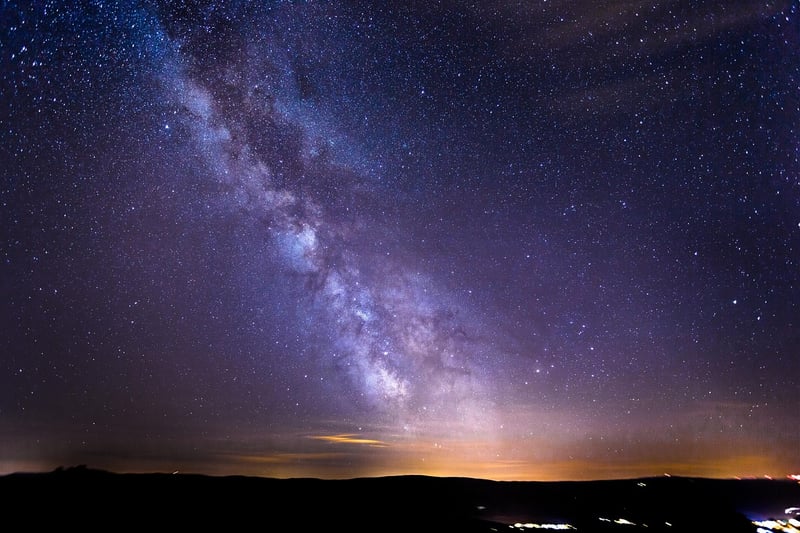 Milky Way over a mystical forest